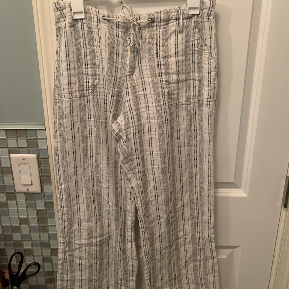 White and black striped straight leg pants.